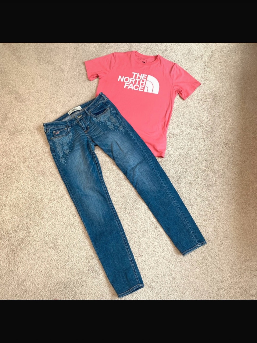 Hollister embroidered jeans and pink north face shirt